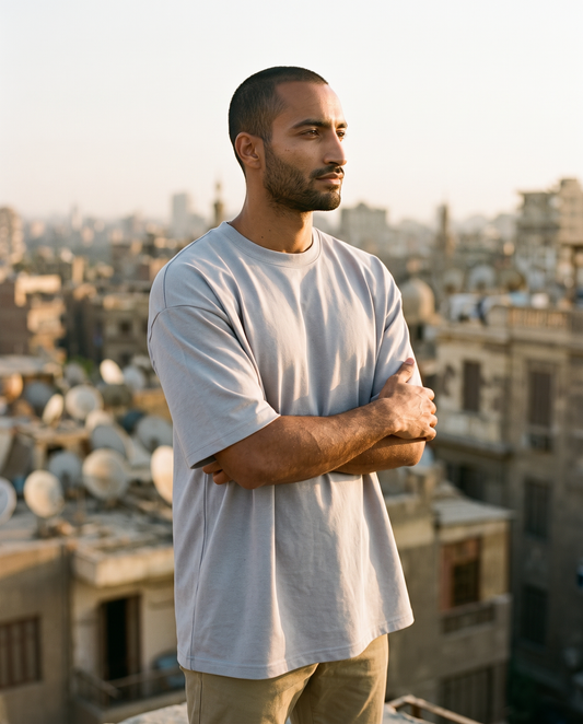ZIL Gray Oversized Tee on model, rooftop