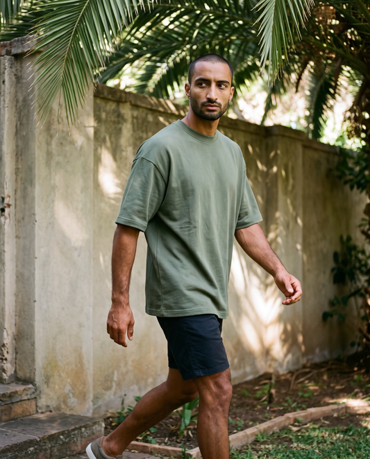 ZIL Army Green Oversized Tee on model, walking, loose fit