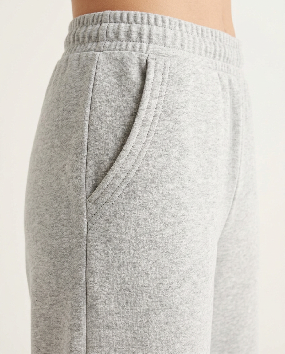 ZIL light gray wide leg pants, close up of the slanted front pocket with three rows of topstitching